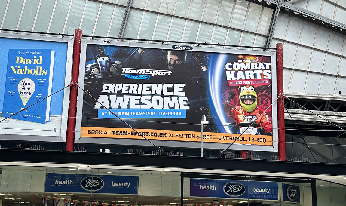 Billboard above a shopping centre concourse promoting Combat Karts at the new TeamSport Liverpool.